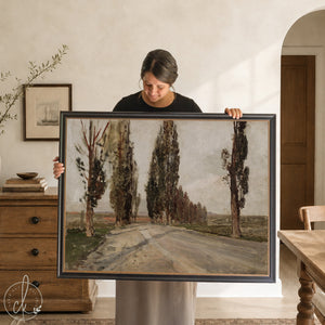 European landscape art print featuring a gold framed vintage tree-lined road painting in muted greens and browns