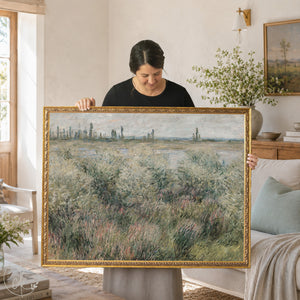 Monet landscape painting of Banks of the Seine near Vétheuil in an ornate gold frame held on a front porch.
