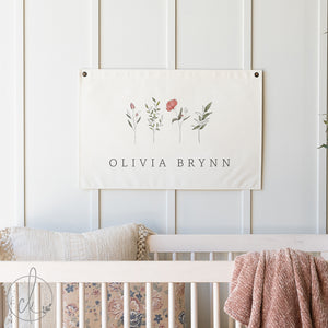 Floral nursery decor canvas flag with personalized baby girl name and watercolor botanicals on cream canvas