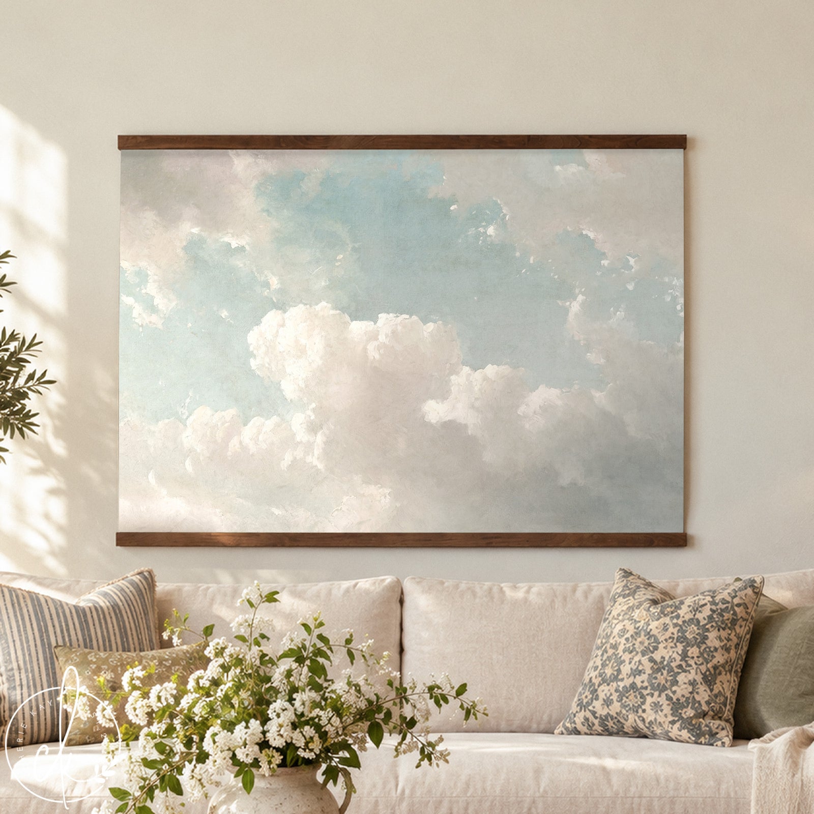 Oversized vintage-style framed wall tapestry featuring a sky with soft white clouds, displayed above a bench. Available in multiple sizes and frame options