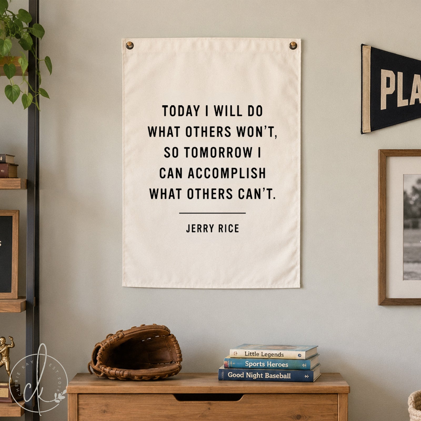 A white rectangular wall poster featuring the black text: TODAY I WILL DO WHAT OTHERS WON'T, SO TOMORROW I CAN ACCOMPLISH WHAT OTHERS CAN'T. JERRY RICE. The poster is secured with two small metal fasteners at the top corners.