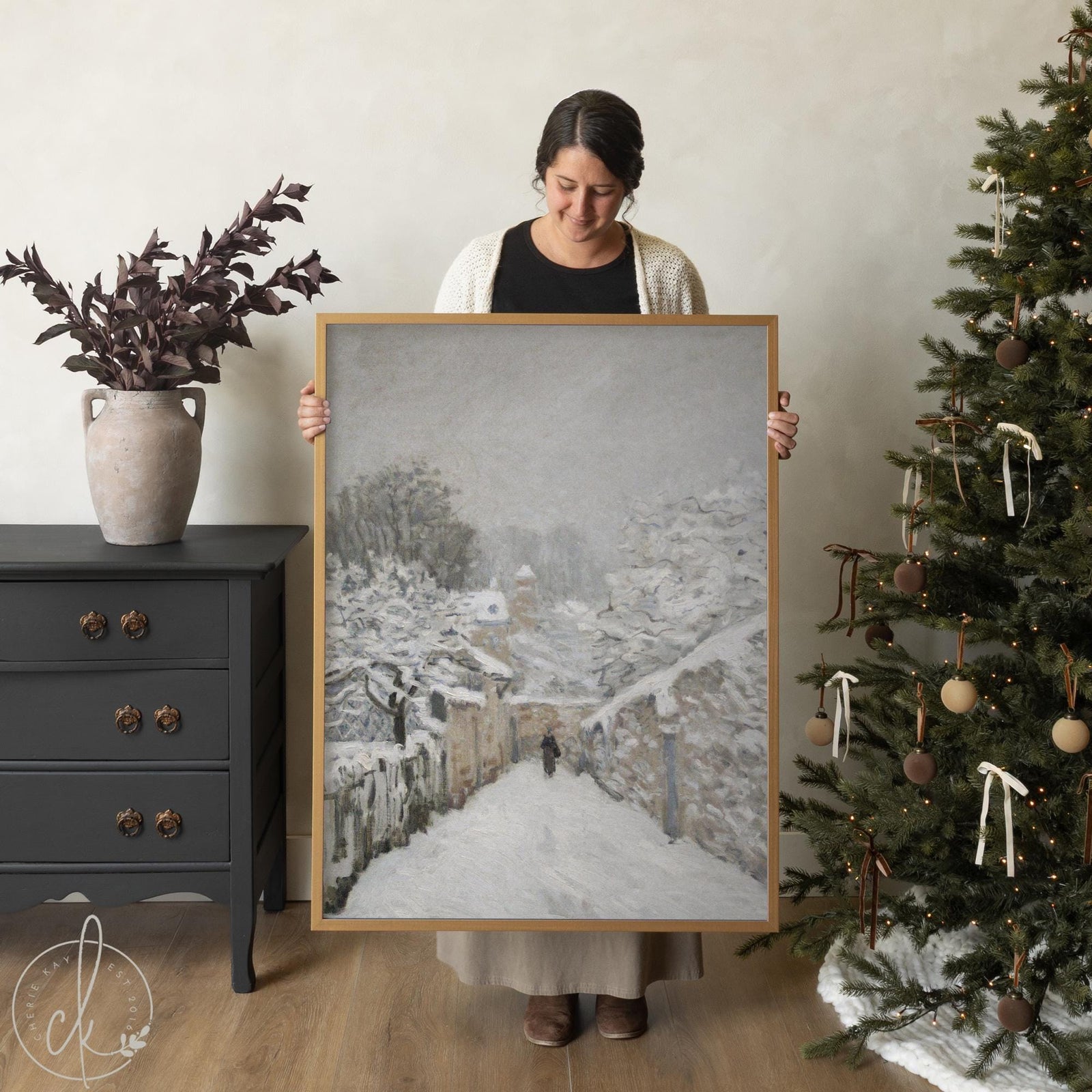 Winter wall art featuring Alfred Sisley’s Snow at Louveciennes framed canvas painting with snowy village scene