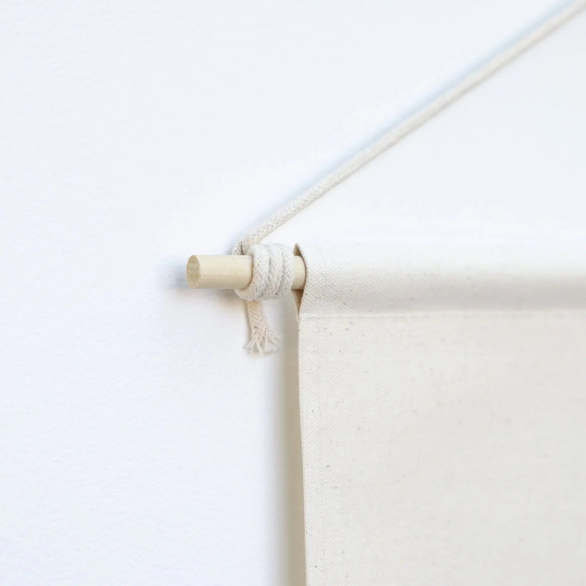 a close up of a canvas dowel rod 