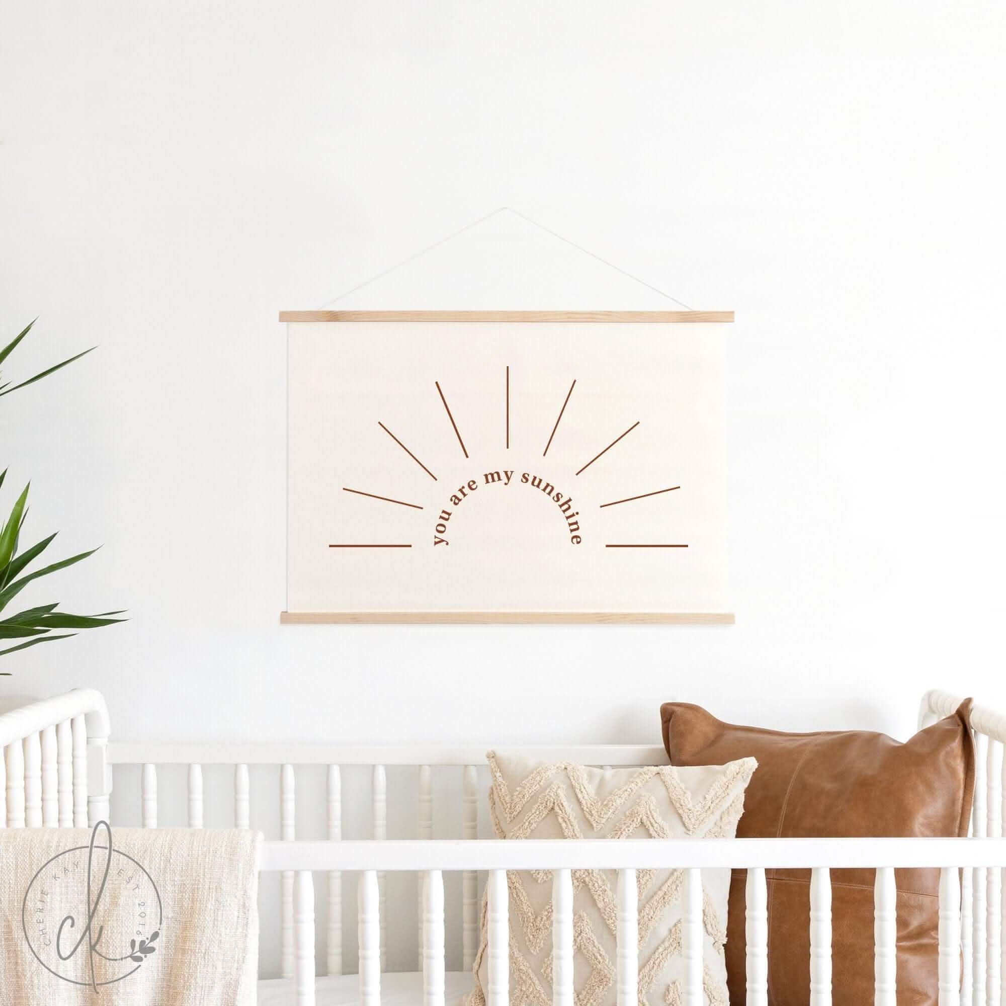 You Are My Sunshine canvas wall hanging displayed in a baby nursery above a crib